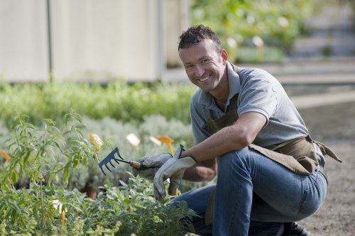 Seasonal maintenance by Hackney Wick gardeners in a courtyard